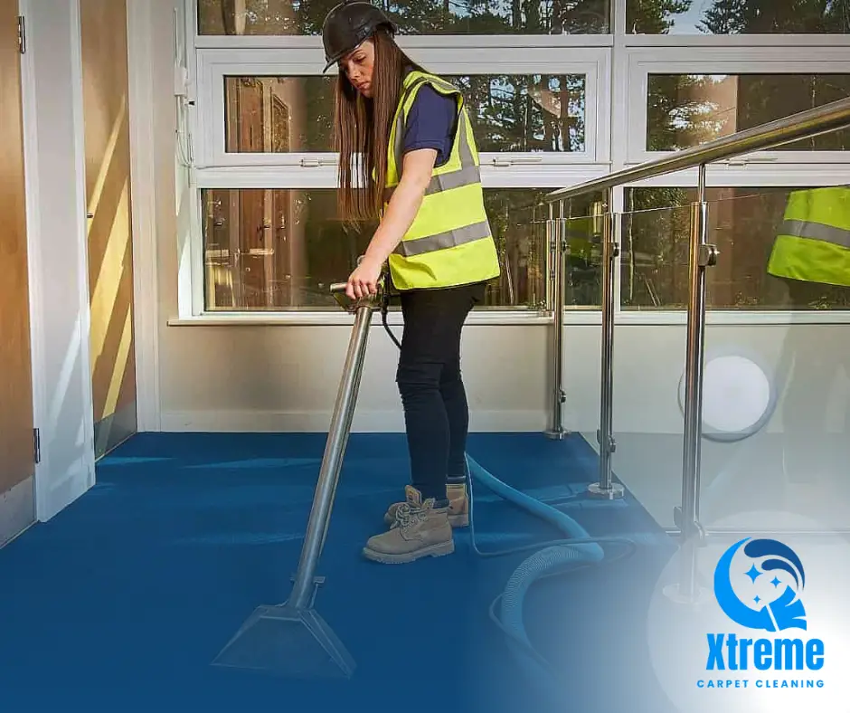 A professional cleaning technician using advanced equipment to clean a large office carpet, illustrating cost-effective maintenance for businesses.