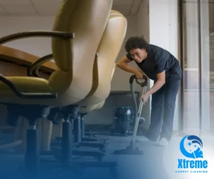 A professional carpet cleaner revitalizing an office carpet using advanced equipment, illustrating how regular cleaning prolongs carpet lifespan.